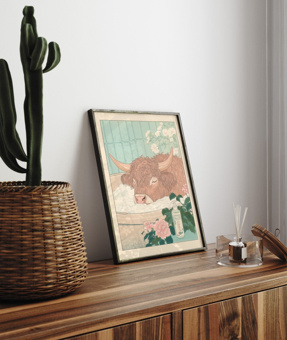 Framed bathroom decor showing a fluffy cow in a bubble bath with Japanese styling