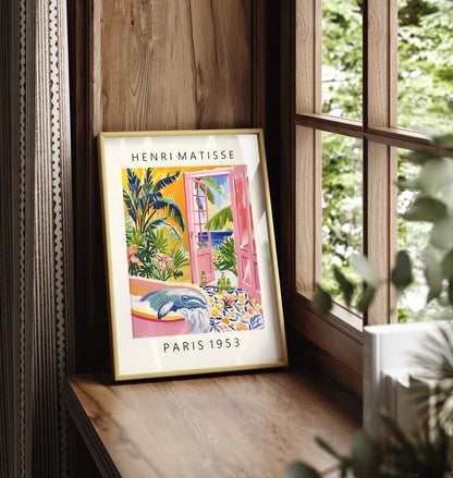 Matisse-style framed wall art featuring a whimsical whale in a tub with vibrant foliage and blue sea in the background.